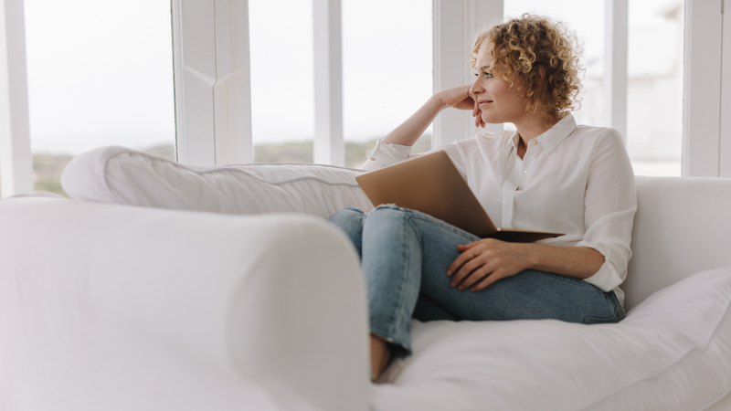 woman sitting on couch